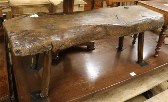 A rustic oak bench seat, W.115cm